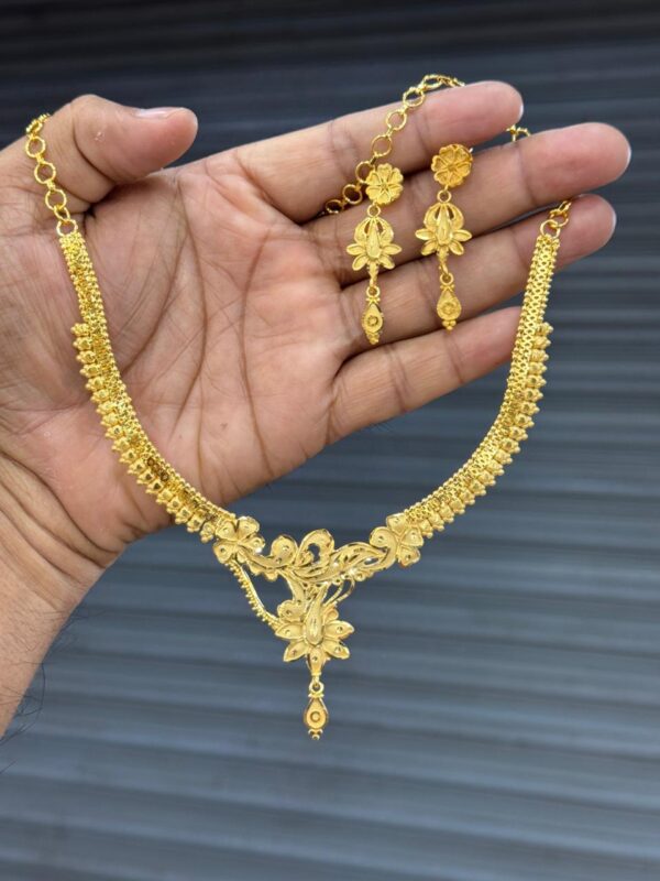 ✅ Product Description: Bring elegance and charm to your jewelry collection with this Premium Gold Plated Pendant Set, featuring a beautifully detailed shankh (conch shell) design that blends tradition with a modern twist. The set is expertly crafted to provide the rich look of real gold while remaining affordable and lightweight. With 100% Color Assurance, you can wear this set confidently for years without worrying about fading or dullness. It’s perfect for daily use, gifting, or adding a graceful touch to festive and cultural occasions. ✅ What’s Included: 1 Premium Gold-Plated Chain – Strong yet lightweight, suitable for all-day wear 1 Designer Pendant (Shankh Design) – Symbolic and elegant 1 Pair of Matching Earrings – Completes the look with balanced simplicity